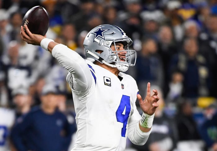 Dallas Cowboys QB Dak Prescott throwing a pass during a game.