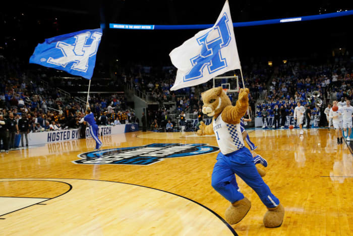 Kentucky mascot runs with UK flag.