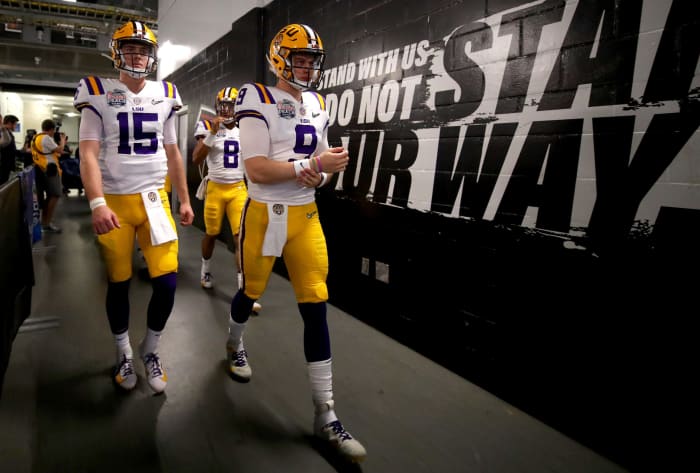 LSU quarterbacks Joe Burrow and Myles Brennan take the field against Oklahoma.