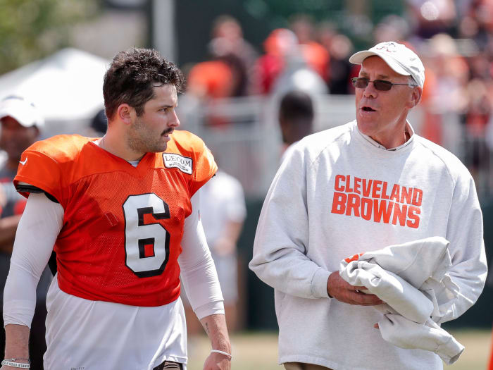 Cleveland Browns GM John Dorsey walks and talks with Baker Mayfield during training camp.