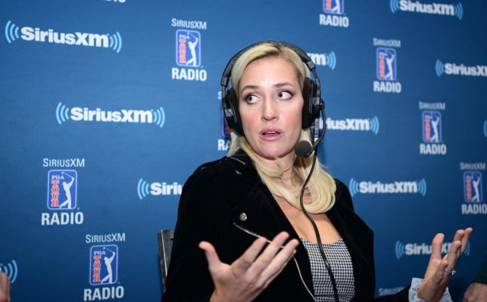 Paige Spiranac speaking at an event.