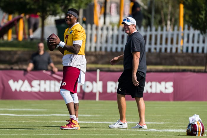 Jay Gruden watches Dwayne Haskins throw.