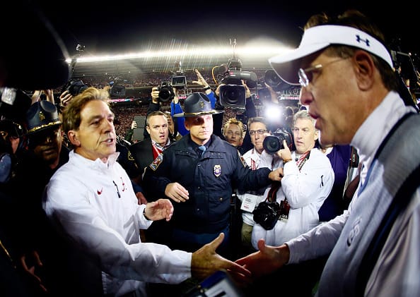 Head coach Nick Saban of the Alabama Crimson Tide shakes hand with head coach Gus Malzahn of the Auburn Tigers.
