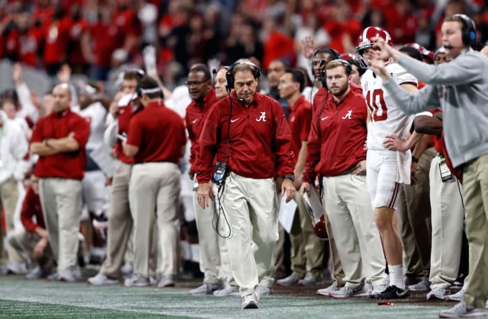 Nick Saban pacing on the Alabama football sideline.