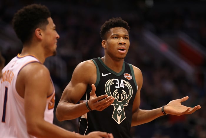 Giannis Antetokounmpo reacting to a call during a game.