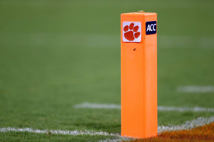 A closeup of a football pylon with Clemon's logo on it.