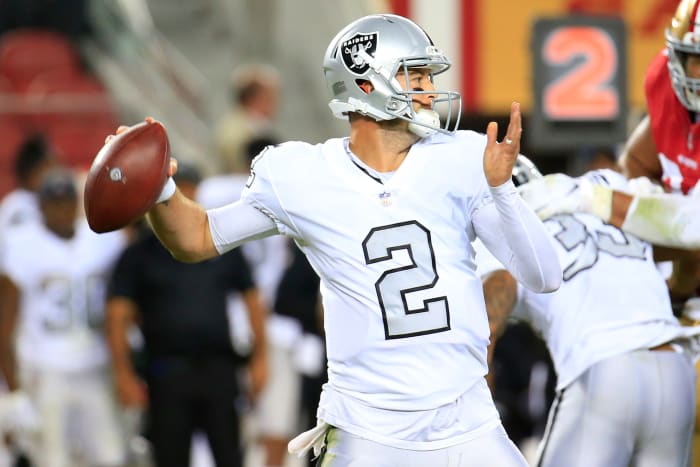 A.J. McCarron attempts a pass for the Oakland Raiders.