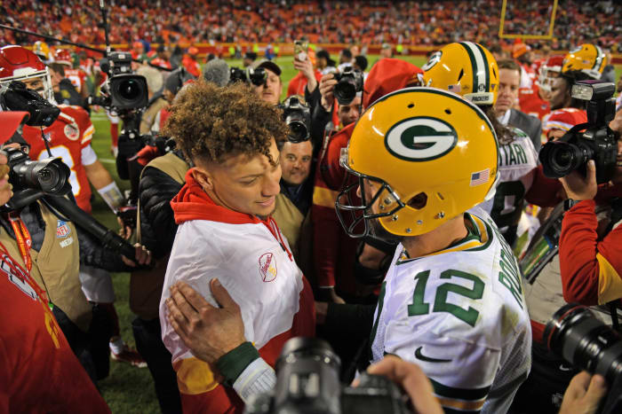 Patrick Mahomes and Aaron Rodgers meet on the field.