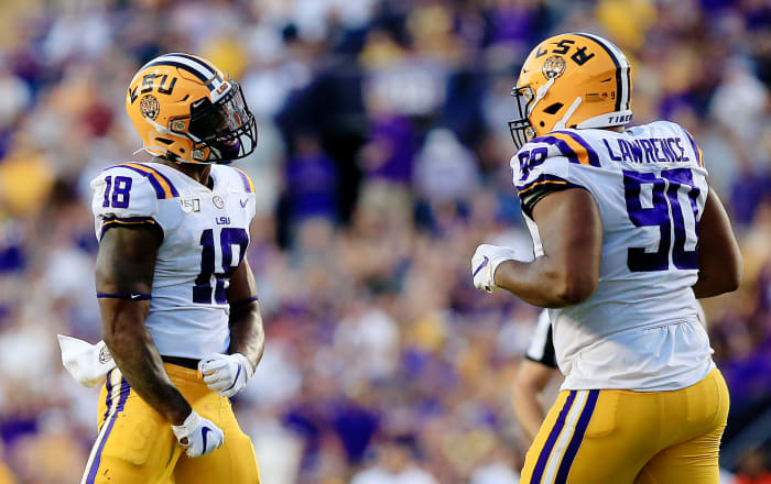 LSU star K'Lavon Chaisson reacts to a play.
