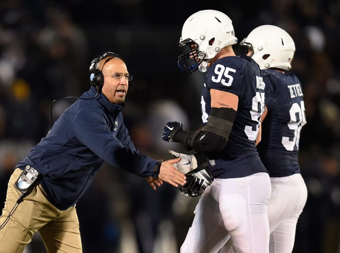James Franklin congratulates Carl Nassib after play.