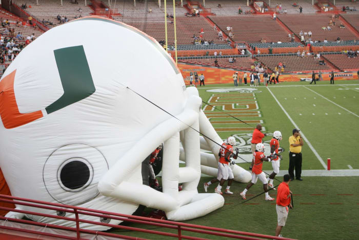 Miami players taking the field for a game.