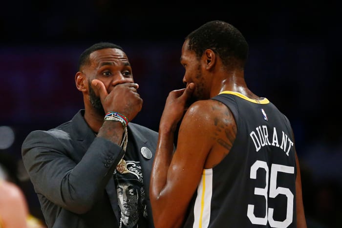 LeBron James talking to Kevin Durant.
