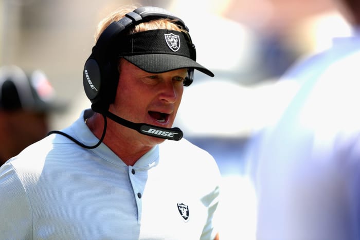 A closeup of Oakland Raiders coach Jon Gruden wearing a white polo.