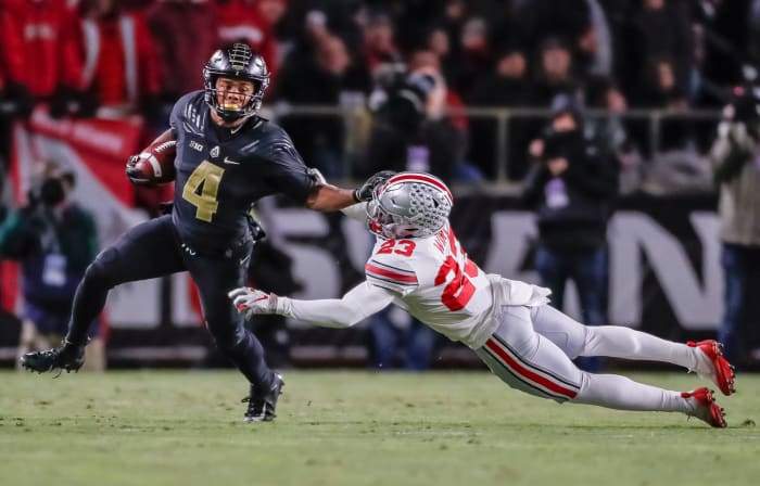 Purdue superstar Rondale Moore breaks an Ohio State tackle during a Big Ten football upset win.