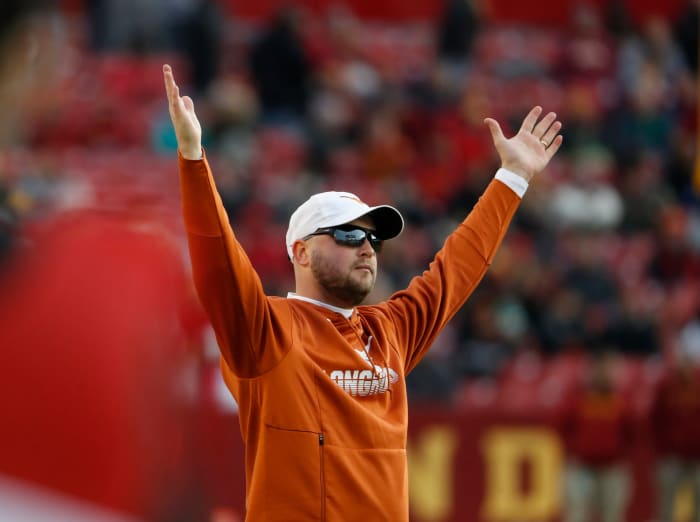 Texas football head coach Tom Herman signals for a touchdown vs. Iowa State.