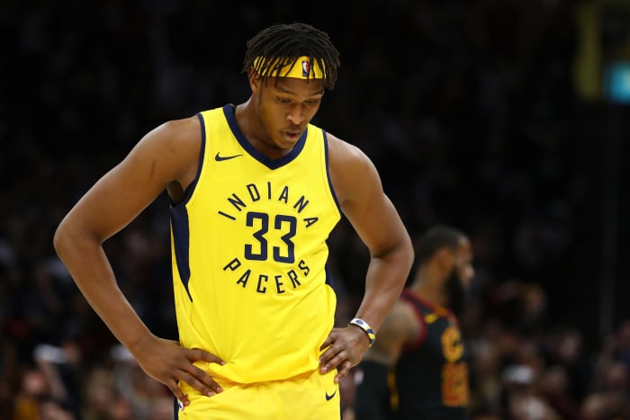 Myles Turner in a yellow Pacers uniform.
