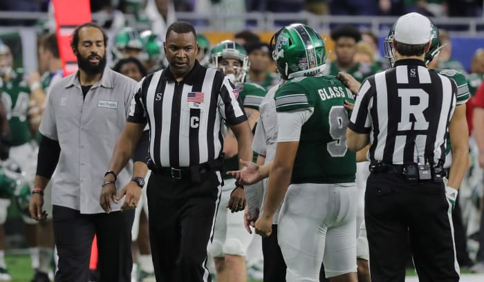 Mike Glass talks to an official.