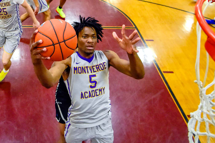 Precious Achiuwa lays the ball up during a high school game.