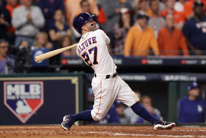 Houston Astros star Jose Altuve hits a home run in the World Series in 2017.