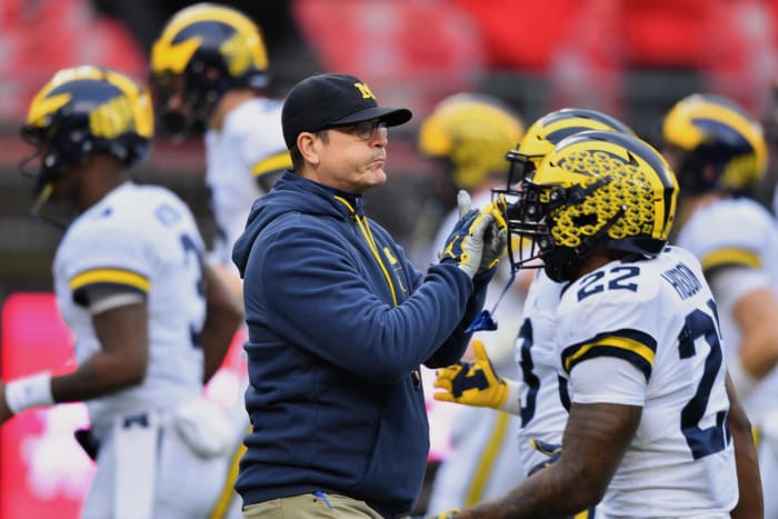 jim harbaugh talks to his players before the ohio state game