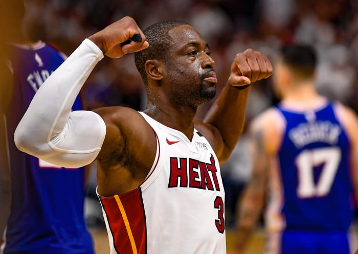 Dwyane Wade flexing his muscles.