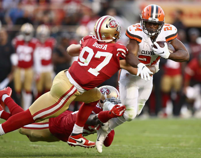 Nick Bosa tackles a Cleveland Browns player.