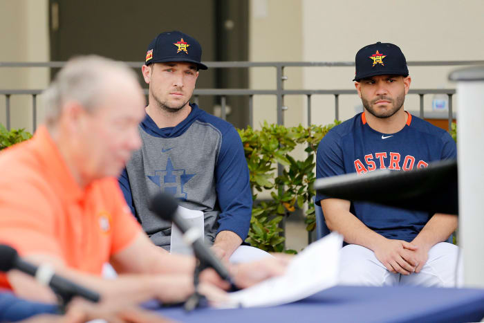 Jose Altuve and Alex Bregman look on as Houston Astros owner Jim Crane gives press conference about cheating scandal.