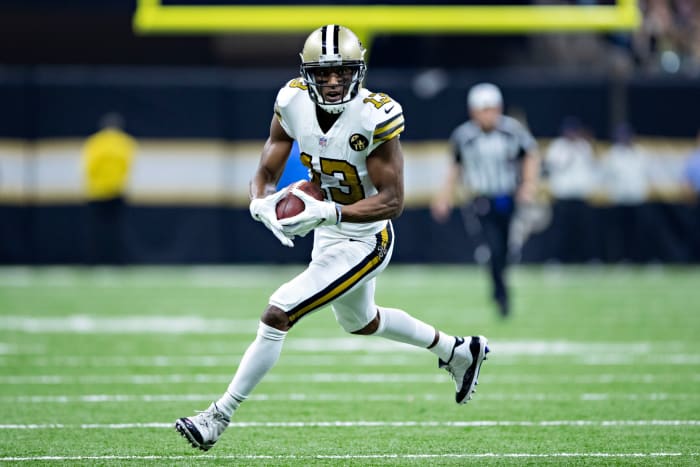 Michael Thomas running with the football during a game.