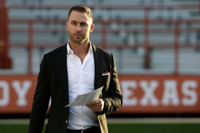 kliff kingsbury strolls the field before a game