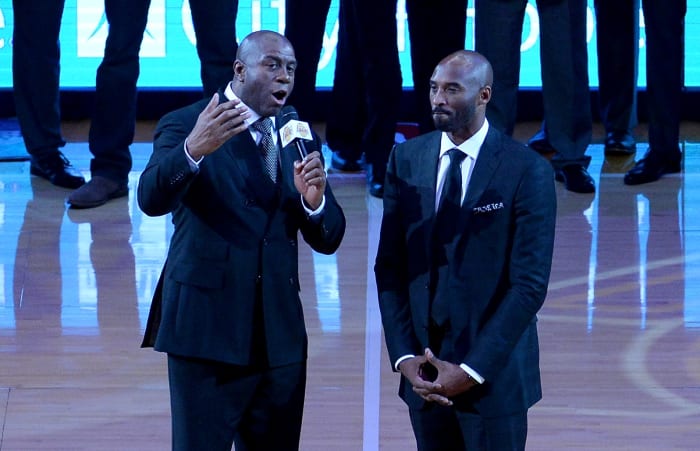 Magic Johnson speaks during Kobe Bryant's on-court ceremony.