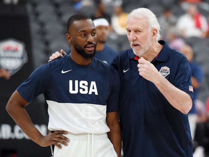 Kemba Walker talks to USA head coach Gregg Popovich.