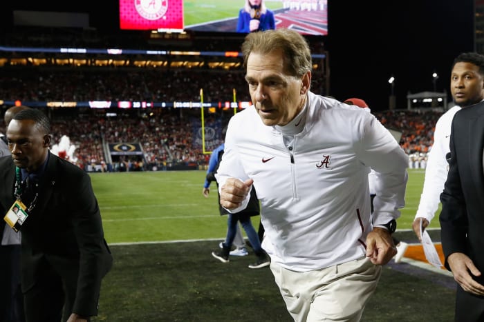 Nick Saban running off the field.