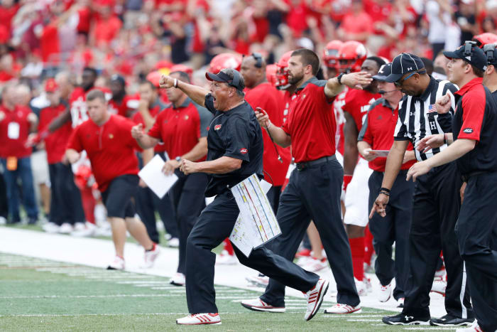 Louisville DC Todd Grantham, now a Mississippi State candidate, celebrates a play.
