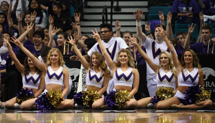 Washington Huskies cheerleaders performing during a game.