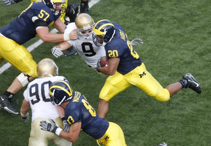 Michigan running back Mike Hart runs the football.