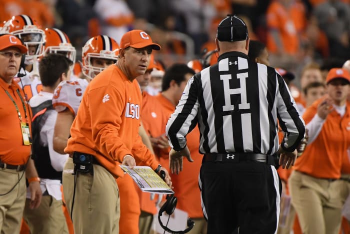 Dabo Swinney speaking to a referee.