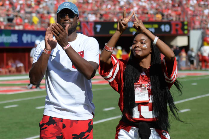 Dwyane Wade and Gabrielle Union cheer on Nebraska football.