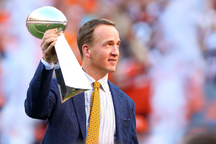 Peyton Manning raising the Super Bowl trophy.