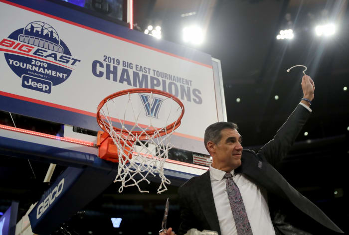Jay Wright cutting down the net for Villanova.