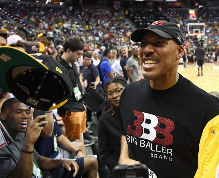 LaVar Ball signing autographs for fans.