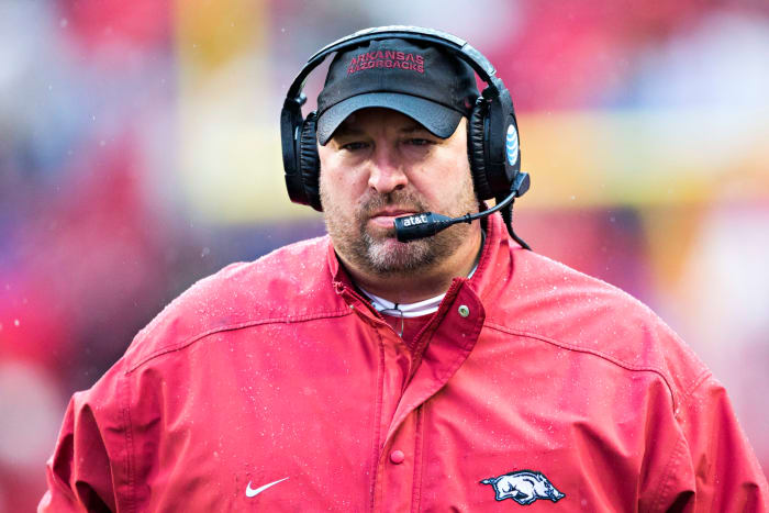 A closeup of Bret Bielema in an Arkansas jumpsuit.