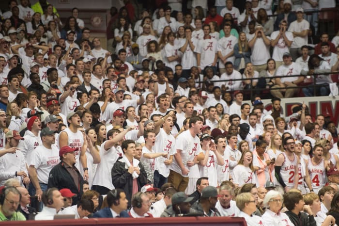 Fans of the Alabama Crimson Tide cheer for their basketball team.