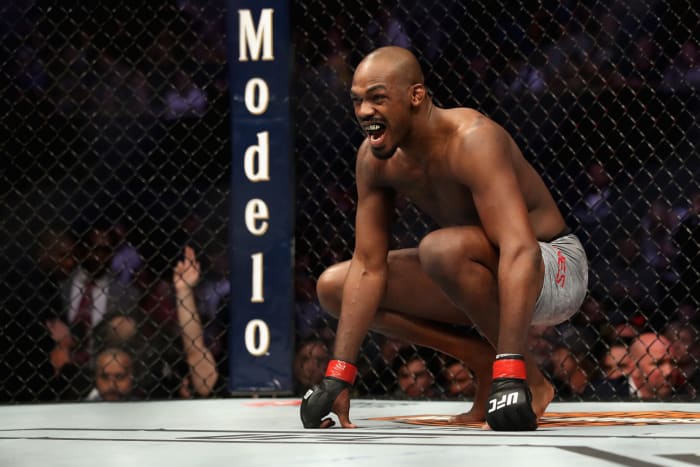 Jon Jones crouching in the Octagon.