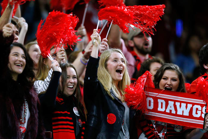 Georgia football fans cheering during a game.