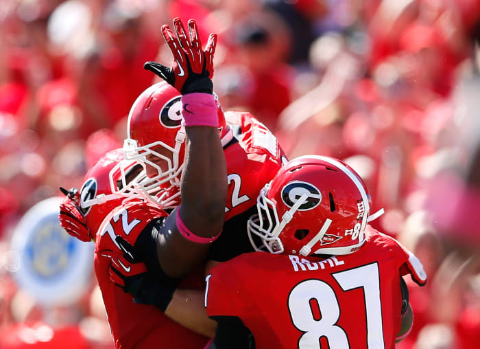 Georgia Bulldogs football players celebrating.