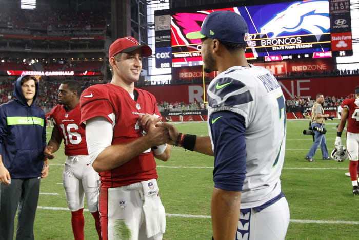 Former UCLA QBs Brett Hundley and Josh Rosen shake hands after game.