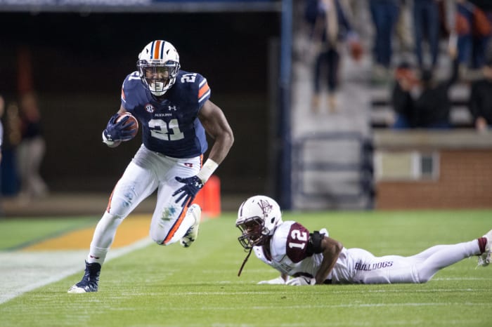Kerryon Johnson runs up the sideline for Auburn.