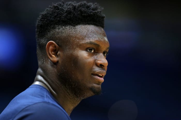 Former Duke star Zion Williamson warms up during an NBA game.