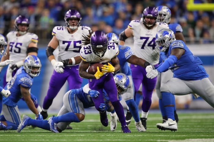 Dalvin Cook running with the football.