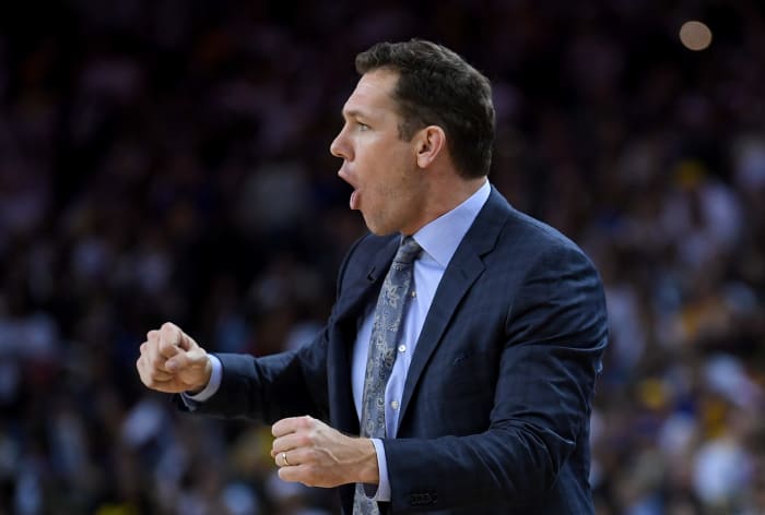 A closeup of Lakers coach Luke Walton reacting during a game.